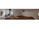 Open living space with hardwood and tile floors, ceiling fans, stainless steel appliances and white cabinets at 1433 Butler St, Jonesboro, GA 30236