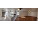 Open living space with hardwood and tile floors, ceiling fans, stainless steel appliances and white cabinets at 1433 Butler St, Jonesboro, GA 30236