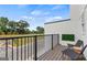 Inviting balcony with comfortable chairs and open railing overlooking a green space at 2581 Astaire Ct, Atlanta, GA 30318