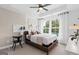 Calm bedroom featuring ample natural light, tray ceiling, and contemporary decor at 2581 Astaire Ct, Atlanta, GA 30318