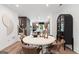 Elegant dining area with modern table, stylish chairs, and hardwood flooring at 2581 Astaire Ct, Atlanta, GA 30318