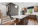 Modern kitchen with white quartz countertop island, stainless steel appliances, and bar stool seating at 2581 Astaire Ct, Atlanta, GA 30318
