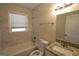 Modern bathroom featuring tile walls, a granite vanity, and a shower-tub combination at 4242 Timber Valley Ct, Decatur, GA 30032
