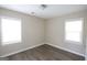 Bright bedroom with ample natural light, wood-look flooring, and neutral wall paint at 4242 Timber Valley Ct, Decatur, GA 30032