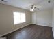 Spacious bedroom with wood-look floors, neutral walls, and a ceiling fan for added comfort at 4242 Timber Valley Ct, Decatur, GA 30032