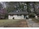 Charming single-story home with a well-maintained front yard and a cozy entrance at 4242 Timber Valley Ct, Decatur, GA 30032