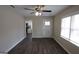 Cozy living room with wood-look flooring, neutral walls, and abundant natural light at 4242 Timber Valley Ct, Decatur, GA 30032