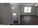 Inviting entryway with wood floors and a staircase leading to the upper level at 1897 Madras Ct, Lithonia, GA 30058