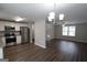 Open-concept kitchen featuring stainless steel appliances and abundant light at 1897 Madras Ct, Lithonia, GA 30058