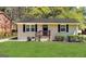 Charming single-story home with a well-manicured lawn and classic black shutters and door at 2336 Polar Rock Ave, Atlanta, GA 30315