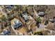 Aerial view of the property featuring a spacious lot, including a pool, house, and surrounding landscape at 610 Graystone Ct, Peachtree City, GA 30269