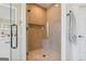 Tiled walk-in shower with glass door, a built-in bench, and modern fixtures at 610 Graystone Ct, Peachtree City, GA 30269
