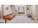 Bright, spacious bedroom with carpet, natural light, and decorative floral wall hangings for a playful atmosphere at 610 Graystone Ct, Peachtree City, GA 30269