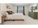 Bedroom features neutral tones, a large window, and modern decor, providing a comfortable retreat at 610 Graystone Ct, Peachtree City, GA 30269