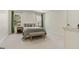 Bedroom with large windows, neutral paint and a comfortable bed with accent pillows and a bench at 610 Graystone Ct, Peachtree City, GA 30269
