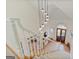 Bright foyer features an elegant staircase, decorative lighting, and a custom front door with sidelights at 610 Graystone Ct, Peachtree City, GA 30269