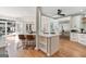 Spacious kitchen with an island, stainless steel appliances, and access to an outdoor patio at 610 Graystone Ct, Peachtree City, GA 30269