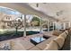 Spacious covered patio offering comfortable lounge area and backyard views at 610 Graystone Ct, Peachtree City, GA 30269