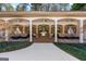 Relaxing pool house boasting an outdoor grill, comfortable seating, and ceiling fans at 610 Graystone Ct, Peachtree City, GA 30269