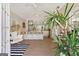 Bright pool house featuring vaulted ceilings, bar seating, and a decorative egg chair at 610 Graystone Ct, Peachtree City, GA 30269
