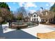 Backyard view of the large pool and beautifully landscaped grounds at 610 Graystone Ct, Peachtree City, GA 30269