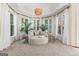 Sunlit sitting area with neutral colors and a view of the outdoors at 610 Graystone Ct, Peachtree City, GA 30269