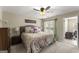 Bedroom with queen bed, nightstands, ceiling fan, and natural light from the windows at 402 Mill Pond Rd # 402, Roswell, GA 30076