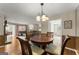 Cozy dining area featuring a round table and views into the adjacent living room at 402 Mill Pond Rd # 402, Roswell, GA 30076