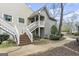 Attractive condo boasts private stairway and covered porch, complemented by neat landscaping at 402 Mill Pond Rd # 402, Roswell, GA 30076