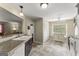 Bright kitchen features a sink, tile countertops and flooring, and white appliances at 402 Mill Pond Rd # 402, Roswell, GA 30076