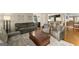 Comfortable living area featuring hardwood floors, ample seating, and natural light at 402 Mill Pond Rd # 402, Roswell, GA 30076