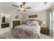 Main bedroom with ceiling fan, neutral walls and carpet, and ensuite bathroom at 402 Mill Pond Rd # 402, Roswell, GA 30076