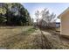 View of backyard, showing a yard space, surrounding trees, and neighborhood at 2536 Lancewood Ln, Lithonia, GA 30058