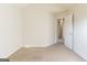 Bedroom with neutral carpet and an open doorway, offering a cozy feel at 2536 Lancewood Ln, Lithonia, GA 30058