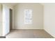 Bedroom featuring neutral carpet, a large window, and a vaulted ceiling at 2536 Lancewood Ln, Lithonia, GA 30058
