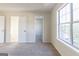 Bedroom with neutral carpet, natural light, and open doorways at 2536 Lancewood Ln, Lithonia, GA 30058