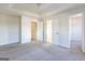 Spacious bedroom featuring tray ceilings, and access to a walk-in closet at 2536 Lancewood Ln, Lithonia, GA 30058