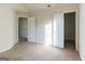 Spacious bedroom with neutral carpet and open closet doors for ample storage at 2536 Lancewood Ln, Lithonia, GA 30058
