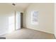 Bedroom with vaulted ceiling, neutral carpet, and a window providing natural light at 2536 Lancewood Ln, Lithonia, GA 30058