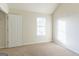 Bedroom featuring carpeted flooring and a window for natural light at 2536 Lancewood Ln, Lithonia, GA 30058