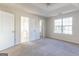 Spacious bedroom features tray ceilings, large window, and ensuite bath at 2536 Lancewood Ln, Lithonia, GA 30058