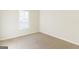 Bright bedroom features neutral carpeting and a large window for natural light at 2536 Lancewood Ln, Lithonia, GA 30058