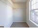 Walk-in closet space with carpet and natural light at 2536 Lancewood Ln, Lithonia, GA 30058