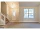 Bright foyer showcasing a chandelier, staircase, and front door with glass detailing at 2536 Lancewood Ln, Lithonia, GA 30058