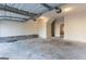 Clean, well-lit garage with concrete flooring and visible door mechanics at 2536 Lancewood Ln, Lithonia, GA 30058