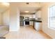 Open-concept layout featuring a well-appointed kitchen with stainless steel appliances and ample counter space at 2536 Lancewood Ln, Lithonia, GA 30058