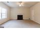 Bright living room featuring neutral walls, a ceiling fan, and a classic fireplace at 2536 Lancewood Ln, Lithonia, GA 30058