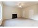 Bright living room featuring neutral walls, carpet, and a door leading outside at 2536 Lancewood Ln, Lithonia, GA 30058