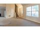 Open-concept living room with natural light and staircase in view at 2536 Lancewood Ln, Lithonia, GA 30058