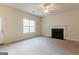 Bright living room showcasing neutral walls, carpet, and a window for natural light at 2536 Lancewood Ln, Lithonia, GA 30058